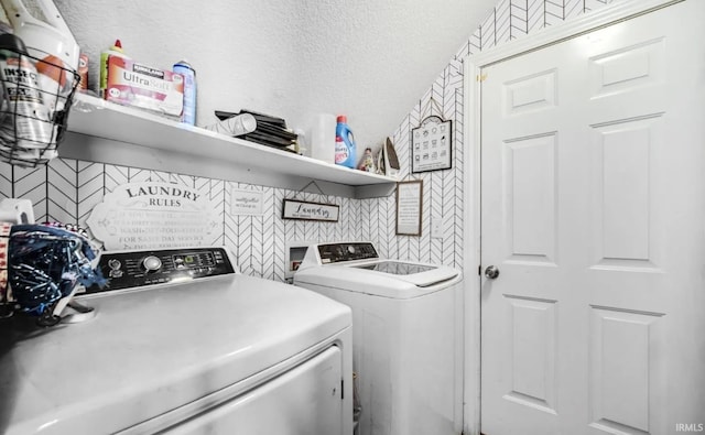 clothes washing area featuring independent washer and dryer