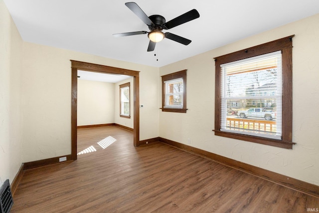 unfurnished room featuring ceiling fan and wood-type flooring