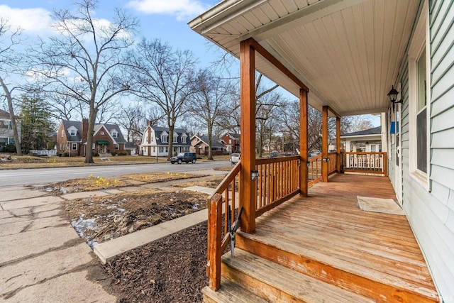 wooden terrace with a porch