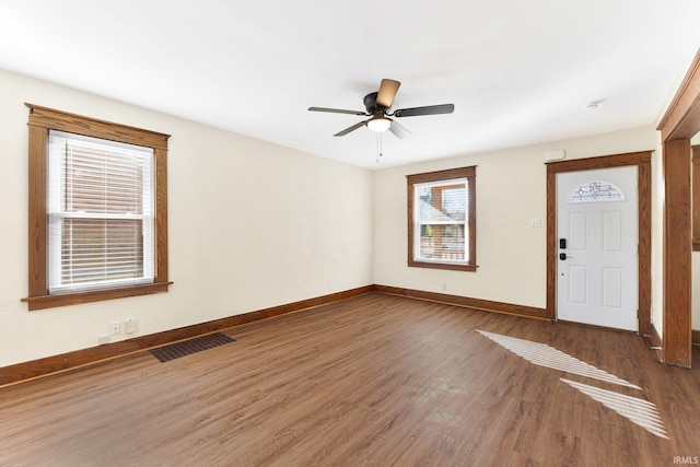 entrance foyer with dark hardwood / wood-style flooring and ceiling fan