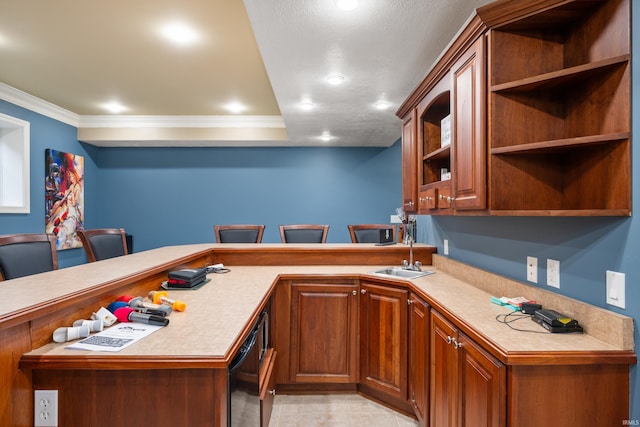 kitchen featuring sink, a breakfast bar, black dishwasher, ornamental molding, and kitchen peninsula