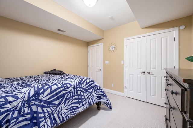 carpeted bedroom featuring a closet