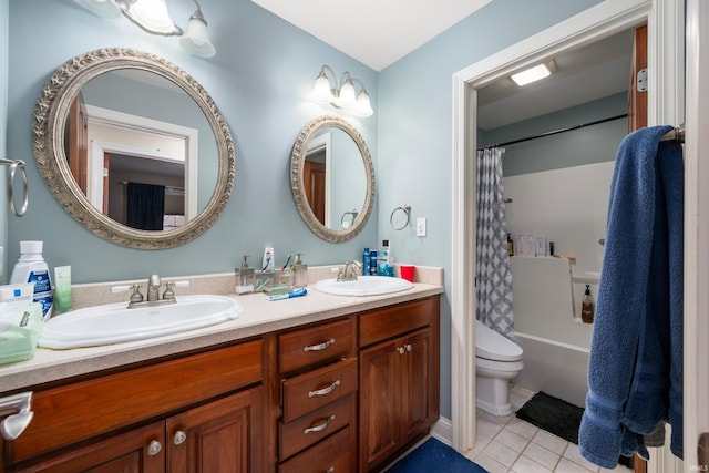 full bathroom featuring vanity, tile patterned floors, toilet, and shower / bath combo with shower curtain