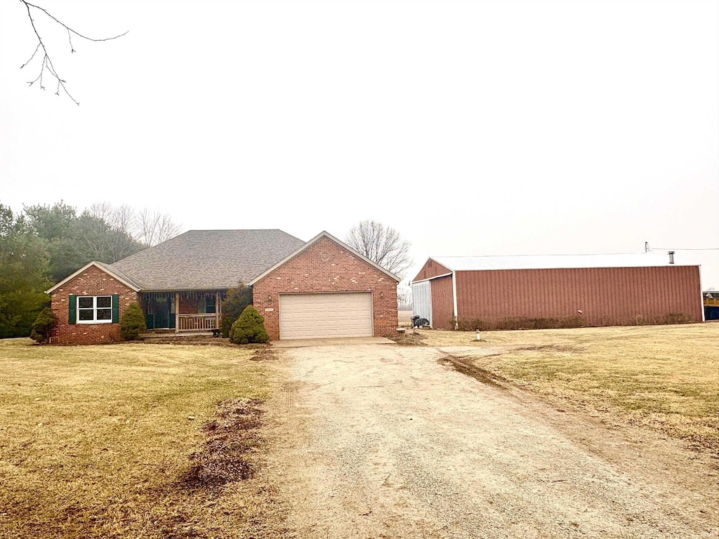 view of front of property with a garage and a front yard