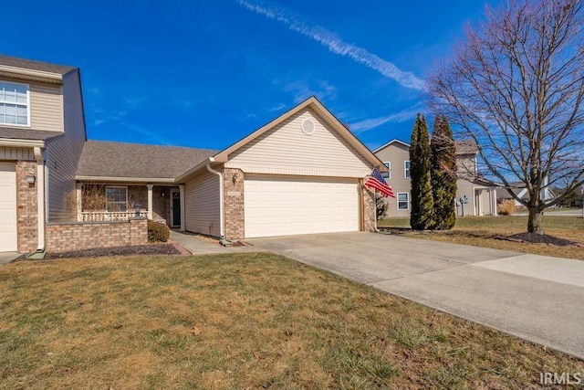 view of front of property with a garage and a front lawn