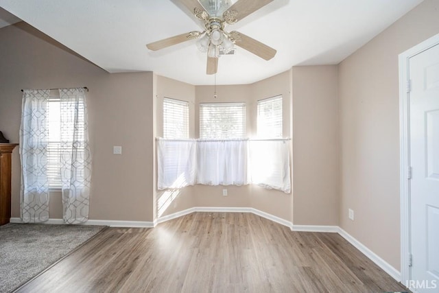 unfurnished room featuring ceiling fan and light wood-type flooring