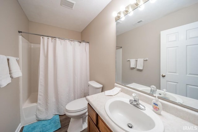 full bathroom featuring vanity, shower / tub combo, wood-type flooring, and toilet