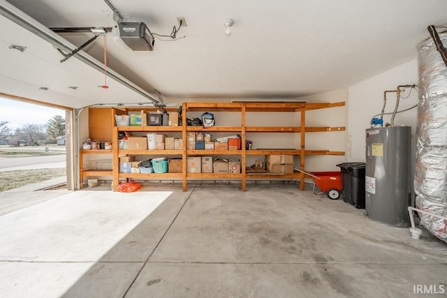 garage featuring a garage door opener and electric water heater