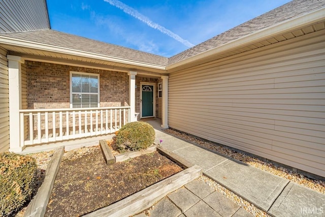 property entrance featuring a porch