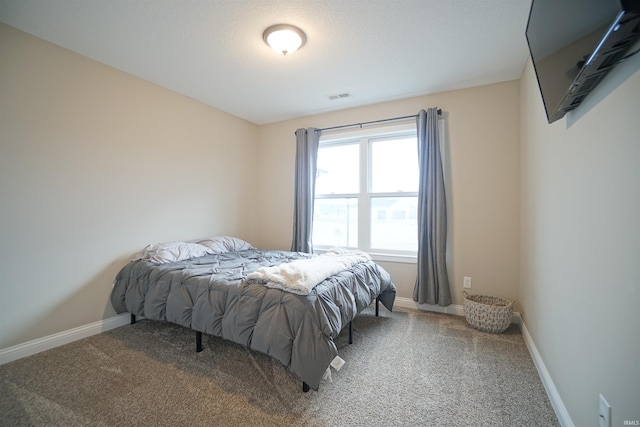 bedroom featuring carpet