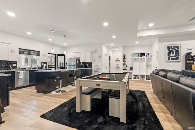 rec room featuring billiards and light hardwood / wood-style flooring