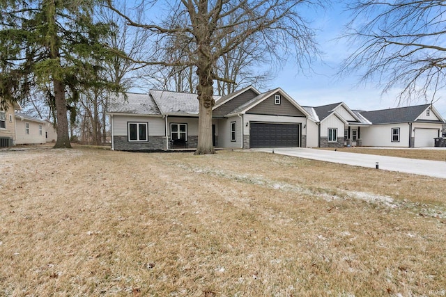 ranch-style house featuring a garage and a front yard