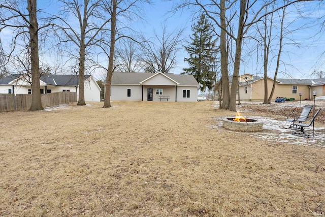 rear view of house featuring a fire pit