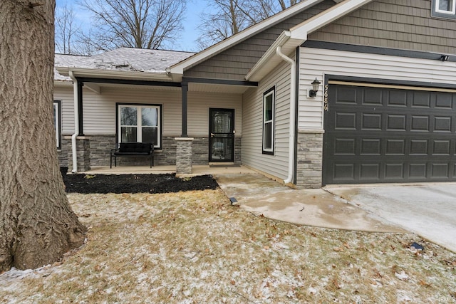 property entrance featuring a garage and a porch