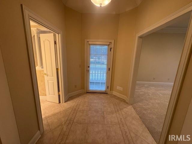 corridor featuring light tile patterned flooring
