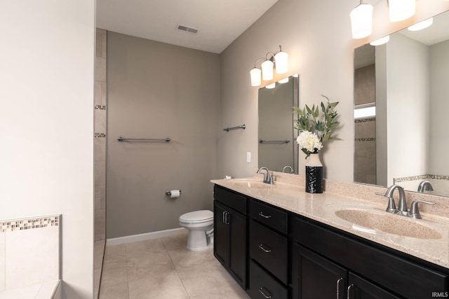 bathroom with vanity, toilet, tile patterned flooring, and radiator heating unit