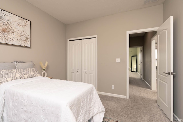 carpeted bedroom with a closet