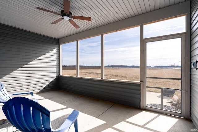 sunroom featuring a rural view