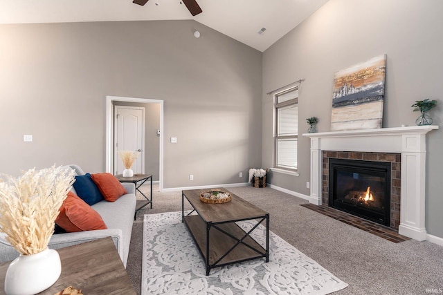 living room with a tile fireplace, carpet, ceiling fan, and high vaulted ceiling