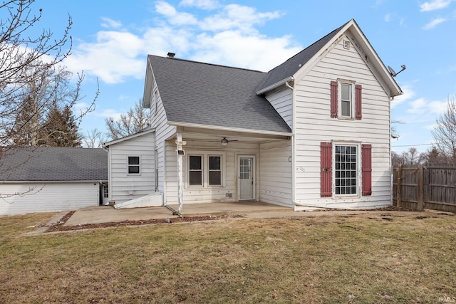 back of property with a patio and a lawn