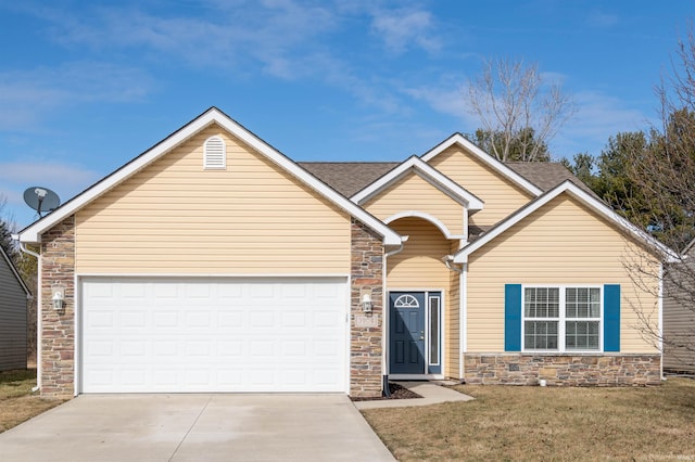 view of front of home with a garage and a front yard