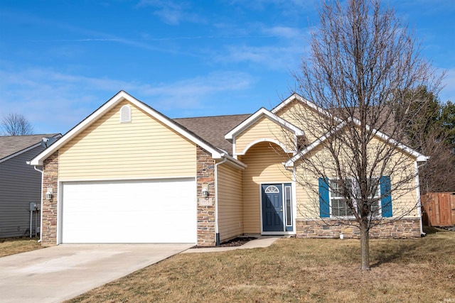 view of front facade featuring a garage and a front lawn