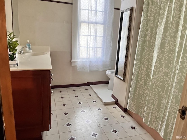 bathroom featuring vanity, toilet, and a shower with shower curtain