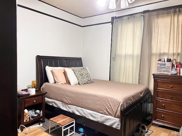 bedroom with light hardwood / wood-style flooring