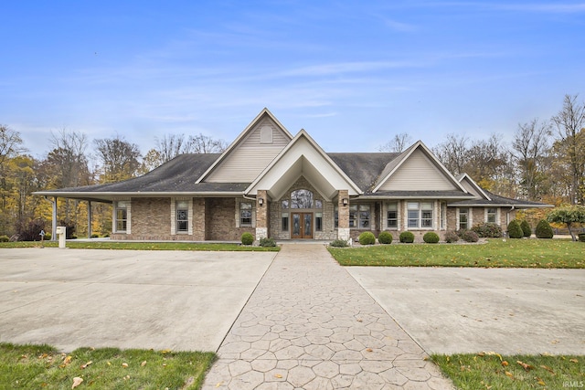 view of front of property with a front lawn and french doors