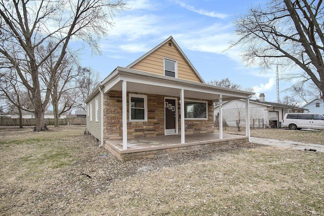 view of front facade featuring a front lawn and a porch