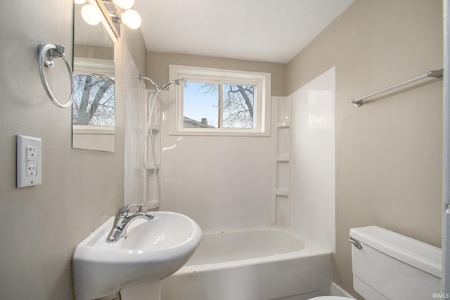 full bathroom with sink, toilet, and washtub / shower combination