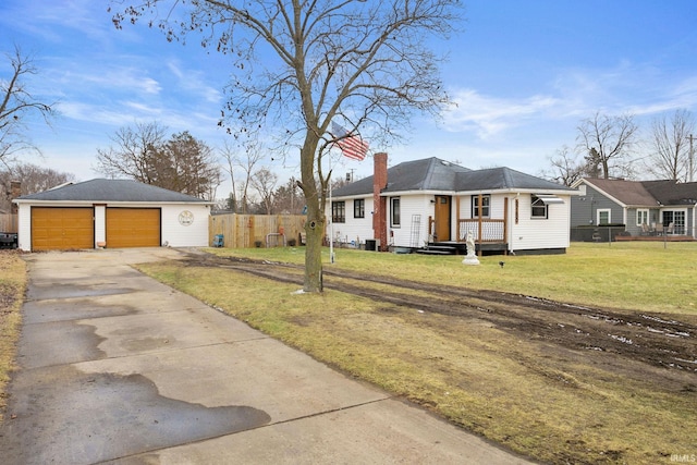 single story home with a garage and a front yard