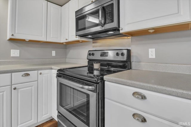 kitchen with stainless steel appliances and white cabinets