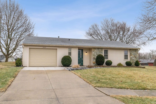 ranch-style home featuring a garage and a front lawn