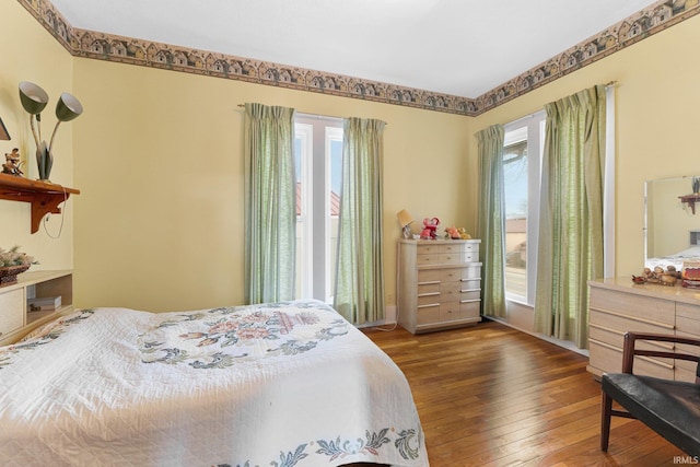 bedroom with hardwood / wood-style flooring