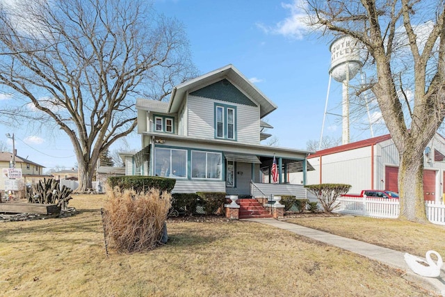 view of front of house featuring a front yard and covered porch