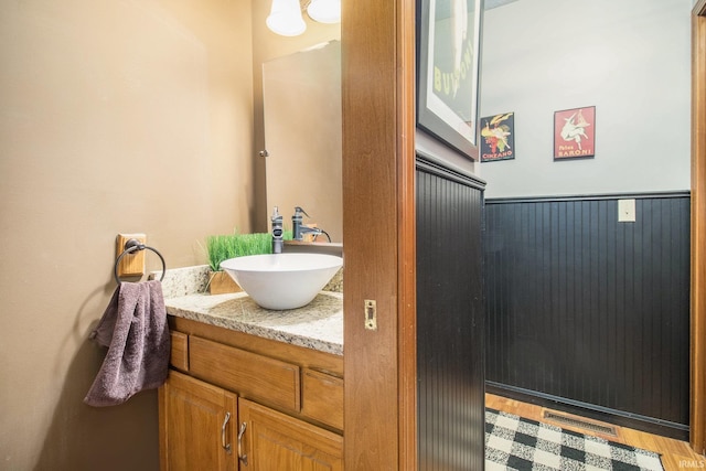 bathroom featuring vanity and wood-type flooring