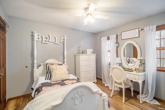 bedroom featuring ceiling fan and light wood-type flooring