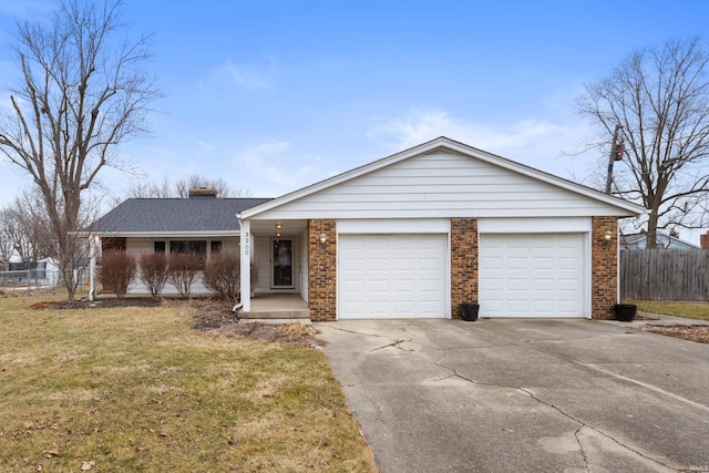 ranch-style home with a garage and a front lawn