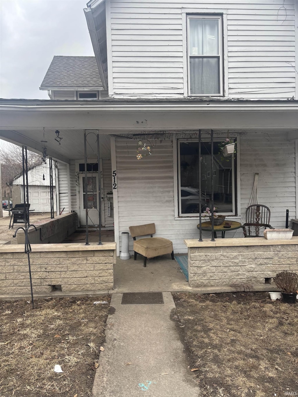 rear view of property with a porch