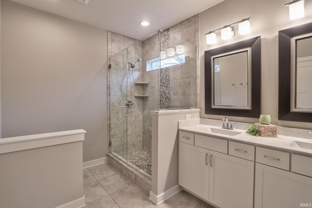 bathroom featuring walk in shower, tile patterned floors, and vanity