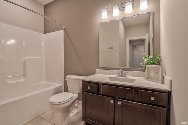 full bathroom featuring vanity, tile patterned floors, washtub / shower combination, and toilet