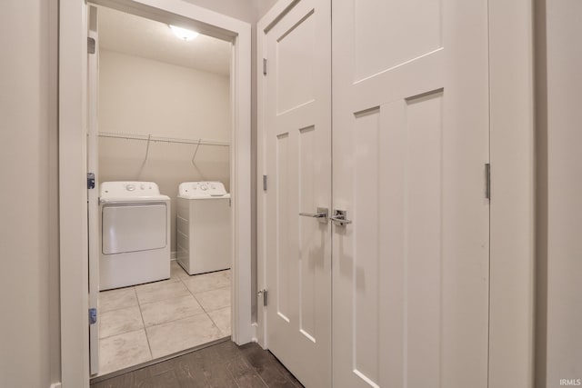 laundry area featuring hardwood / wood-style flooring and washer and dryer