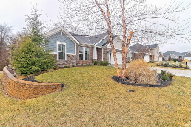 view of front of house with a garage and a front lawn