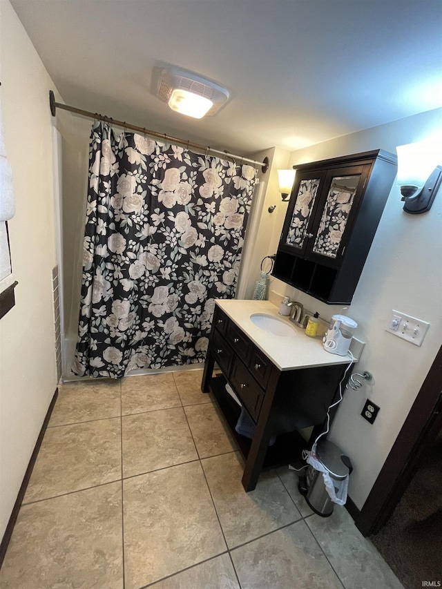 bathroom with vanity and tile patterned floors