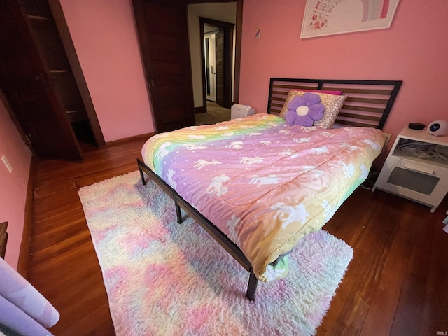 bedroom featuring dark hardwood / wood-style floors