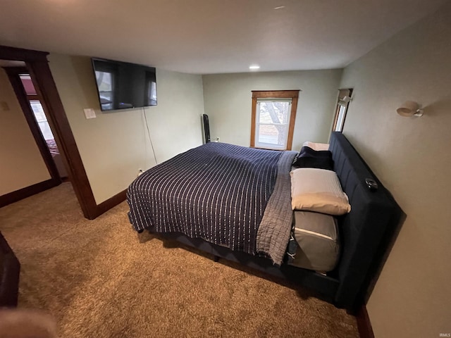 bedroom featuring light colored carpet