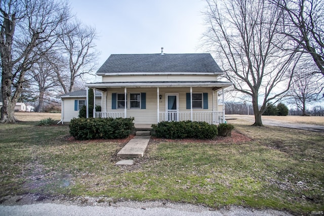 view of front of property with a porch and a front yard