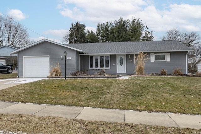 ranch-style home with a garage and a front lawn