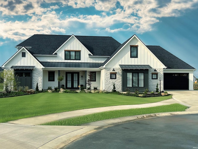 modern inspired farmhouse with a standing seam roof, a shingled roof, a front lawn, and concrete driveway